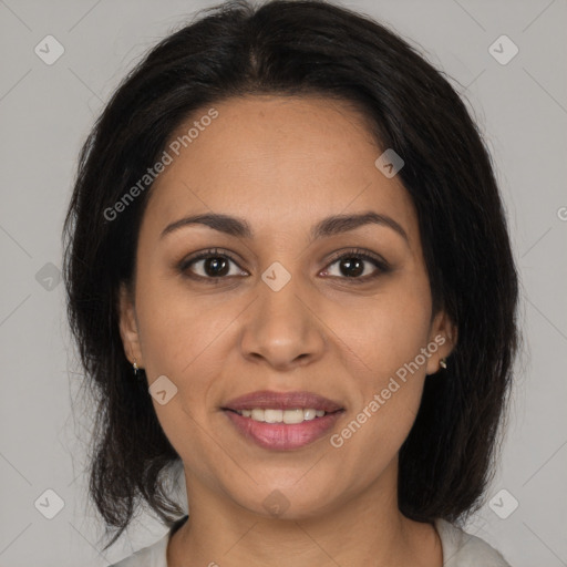 Joyful latino young-adult female with medium  brown hair and brown eyes