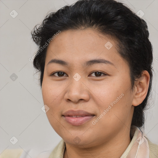 Joyful latino young-adult female with medium  brown hair and brown eyes