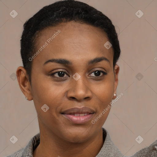 Joyful black young-adult female with short  black hair and brown eyes