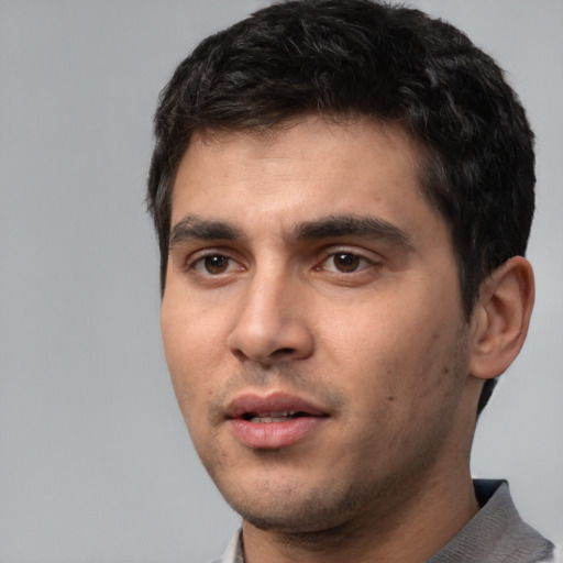 Neutral white young-adult male with short  black hair and brown eyes