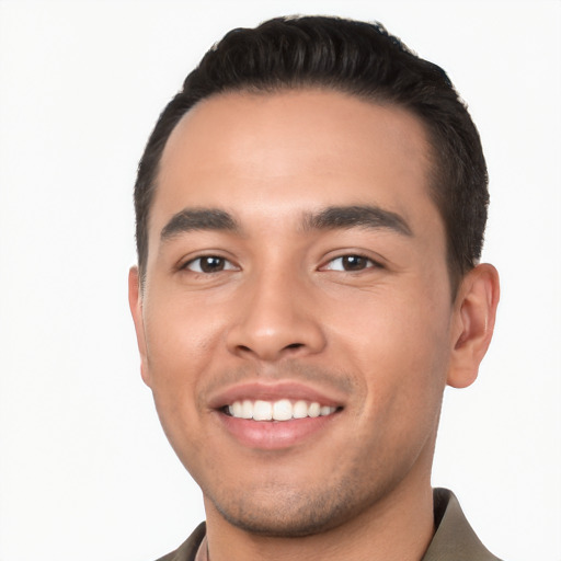 Joyful white young-adult male with short  black hair and brown eyes