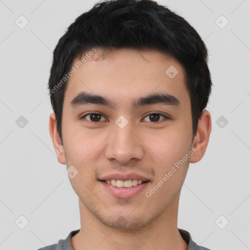 Joyful white young-adult male with short  black hair and brown eyes