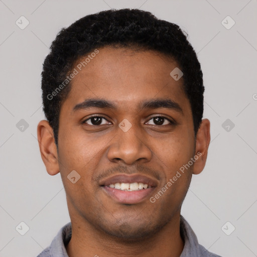 Joyful black young-adult male with short  black hair and brown eyes