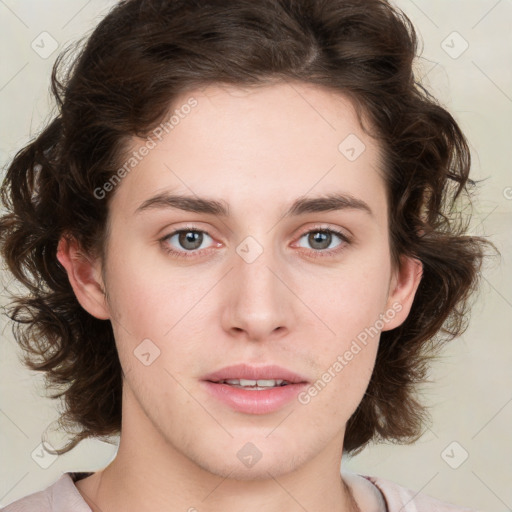 Joyful white young-adult female with medium  brown hair and green eyes