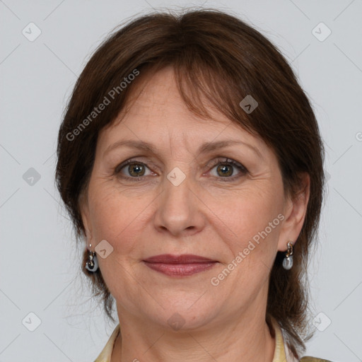 Joyful white adult female with medium  brown hair and grey eyes