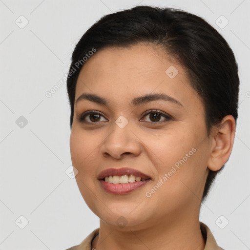 Joyful latino young-adult female with short  brown hair and brown eyes