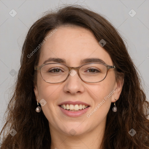 Joyful white adult female with long  brown hair and grey eyes