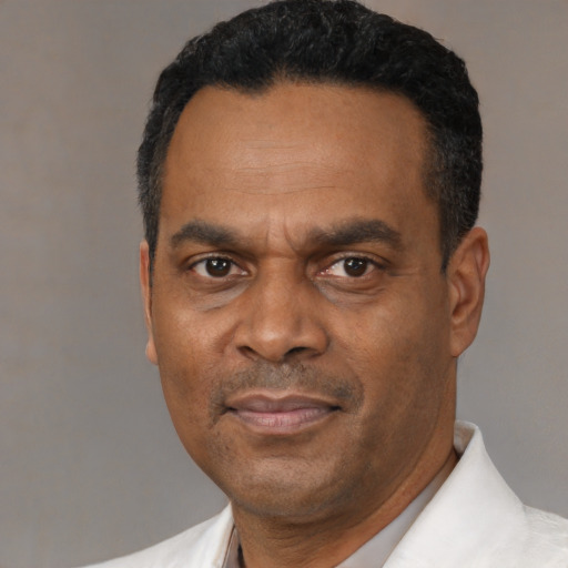 Neutral black adult male with short  black hair and brown eyes