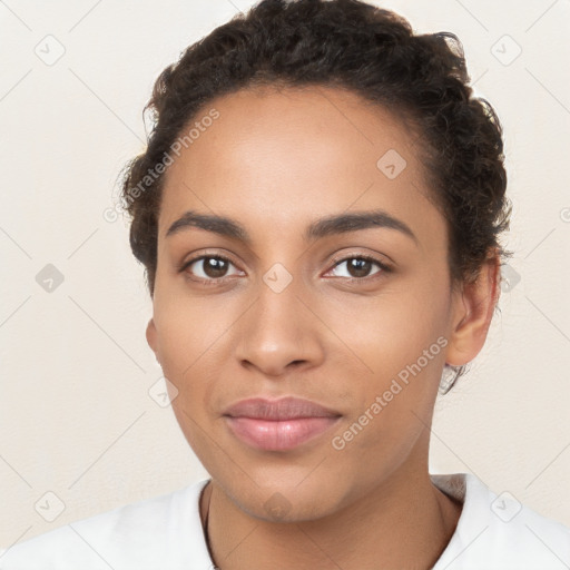 Joyful latino young-adult female with short  brown hair and brown eyes