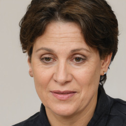 Joyful white middle-aged female with short  brown hair and brown eyes