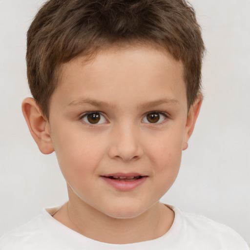 Joyful white child male with short  brown hair and brown eyes