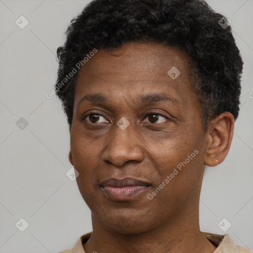 Joyful black adult male with short  black hair and brown eyes