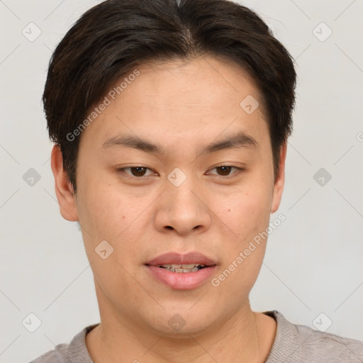 Joyful asian young-adult male with short  brown hair and brown eyes