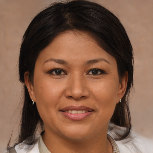 Joyful asian young-adult female with medium  brown hair and brown eyes