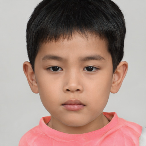 Neutral asian child male with short  brown hair and brown eyes