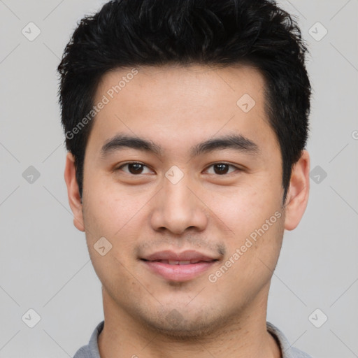 Joyful asian young-adult male with short  black hair and brown eyes