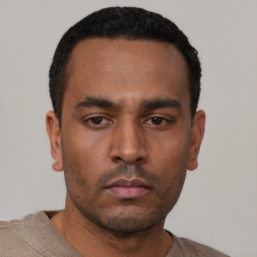 Neutral latino young-adult male with short  black hair and brown eyes