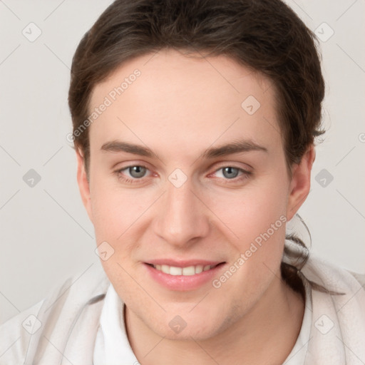 Joyful white young-adult female with short  brown hair and grey eyes