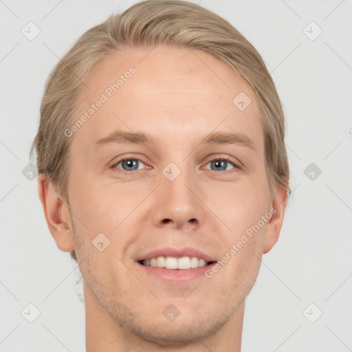 Joyful white adult male with short  brown hair and grey eyes