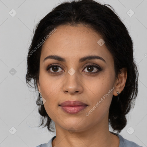 Joyful latino young-adult female with medium  brown hair and brown eyes