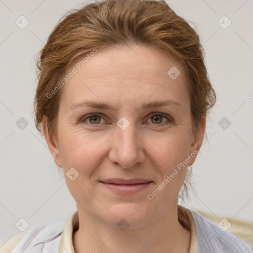 Joyful white adult female with medium  brown hair and grey eyes