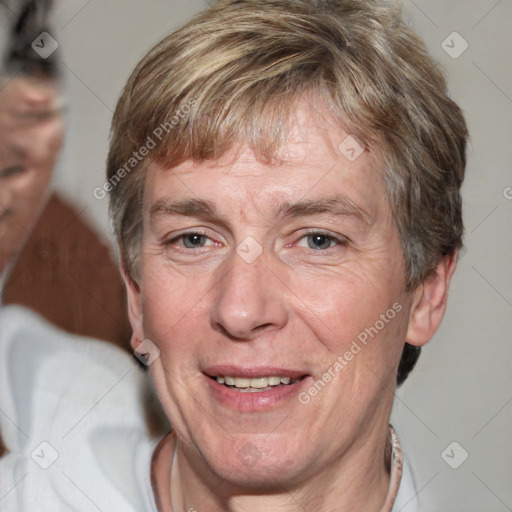 Joyful white adult male with short  brown hair and grey eyes