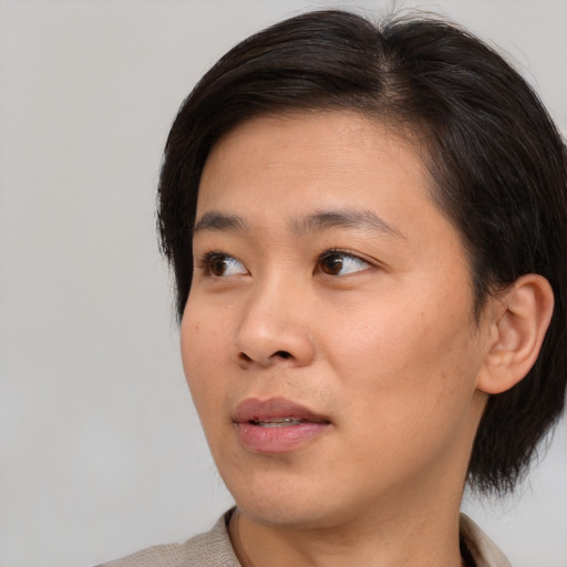 Neutral asian young-adult female with short  brown hair and brown eyes