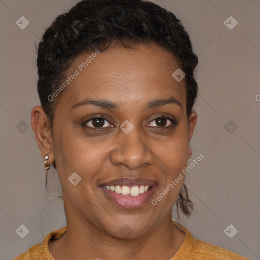 Joyful black young-adult female with short  brown hair and brown eyes