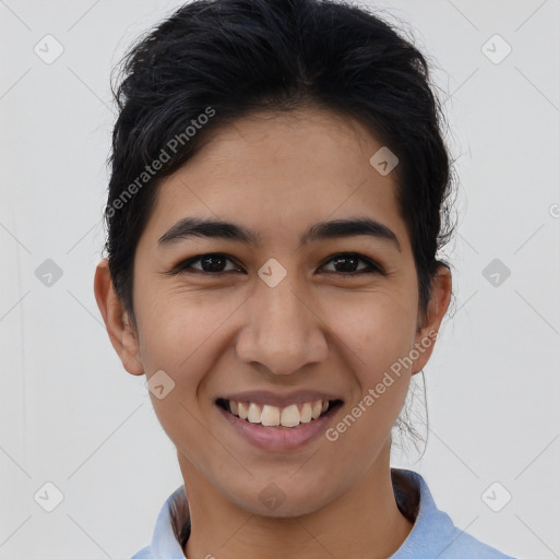 Joyful asian young-adult female with short  black hair and brown eyes