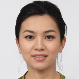 Joyful asian young-adult female with medium  black hair and brown eyes