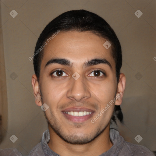 Joyful latino young-adult male with short  brown hair and brown eyes