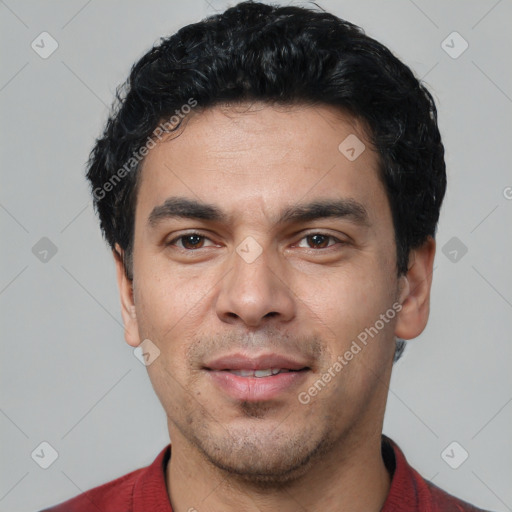 Joyful white young-adult male with short  black hair and brown eyes