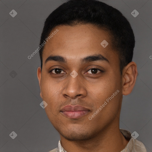 Joyful black young-adult male with short  brown hair and brown eyes