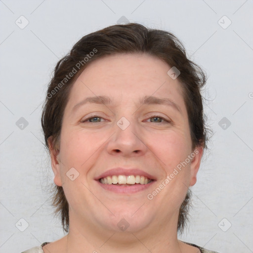 Joyful white adult female with short  brown hair and brown eyes