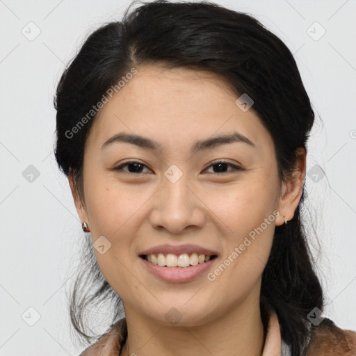 Joyful asian young-adult female with medium  black hair and brown eyes