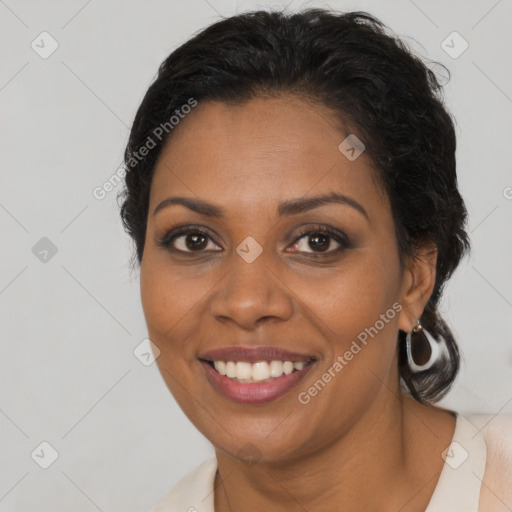 Joyful black young-adult female with medium  brown hair and brown eyes