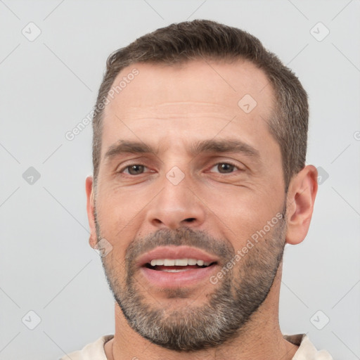 Joyful white adult male with short  brown hair and brown eyes