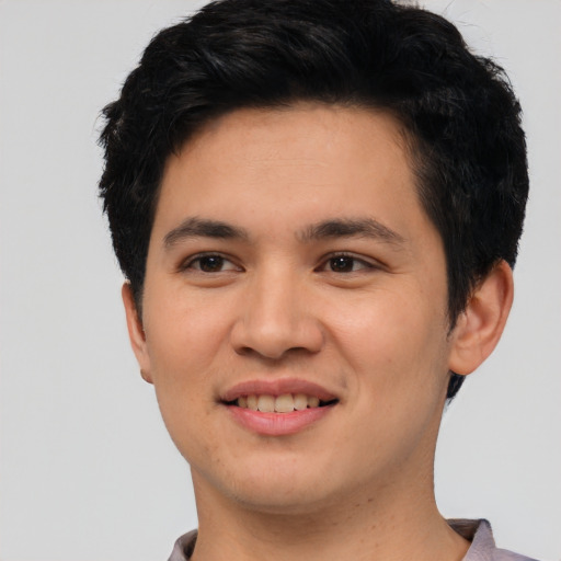 Joyful asian young-adult male with short  black hair and brown eyes