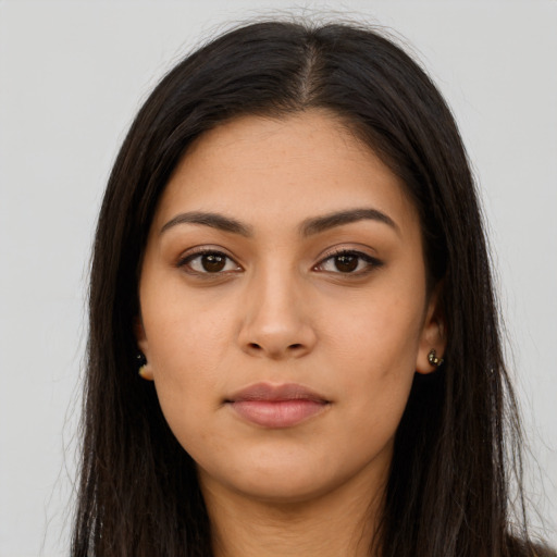 Neutral latino young-adult female with long  brown hair and brown eyes