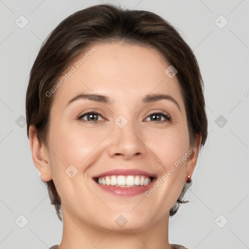 Joyful white young-adult female with medium  brown hair and brown eyes