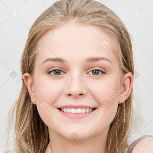 Joyful white young-adult female with long  brown hair and blue eyes