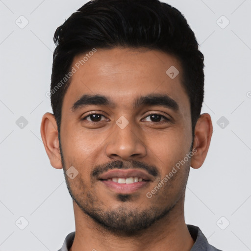 Joyful latino young-adult male with short  black hair and brown eyes