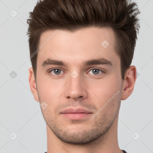 Neutral white young-adult male with short  brown hair and brown eyes