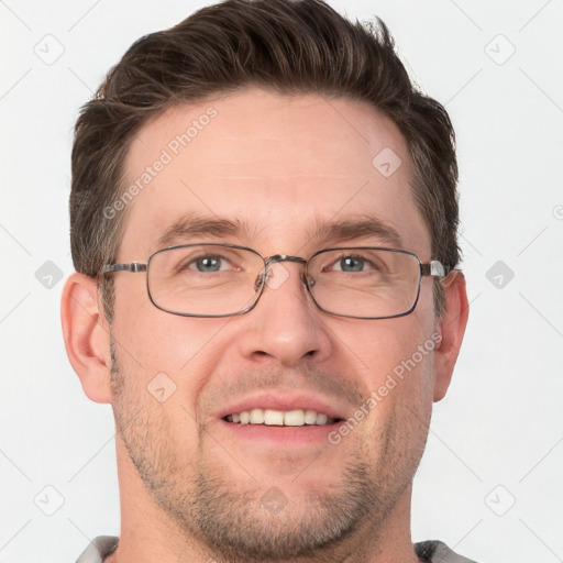 Joyful white adult male with short  brown hair and grey eyes