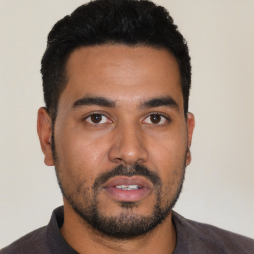 Neutral latino young-adult male with short  black hair and brown eyes