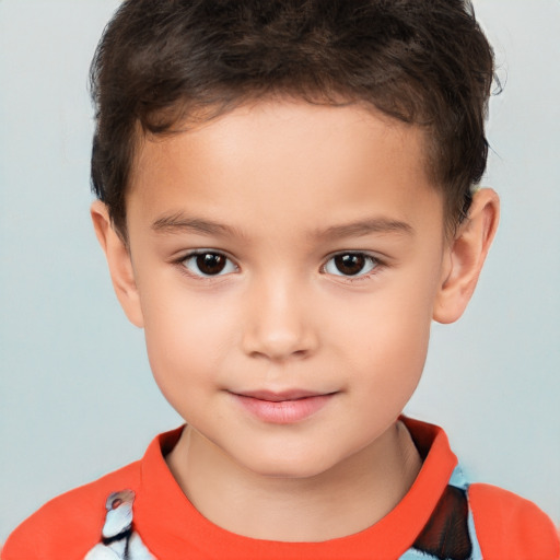 Joyful white child male with short  brown hair and brown eyes