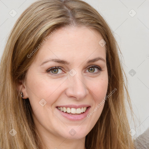 Joyful white young-adult female with long  brown hair and green eyes