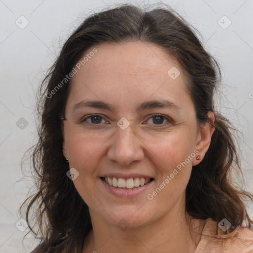 Joyful white adult female with long  brown hair and brown eyes