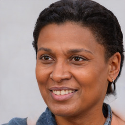 Joyful black adult female with short  brown hair and brown eyes