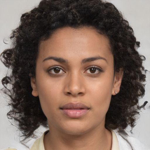 Neutral black young-adult female with medium  brown hair and brown eyes